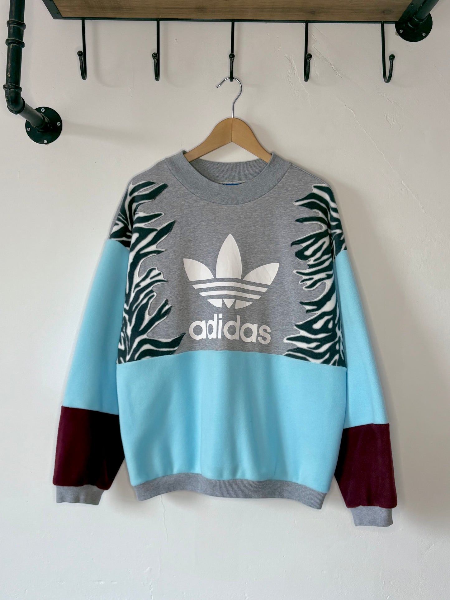 Adidas zebra stripe fleece sweatshirt.