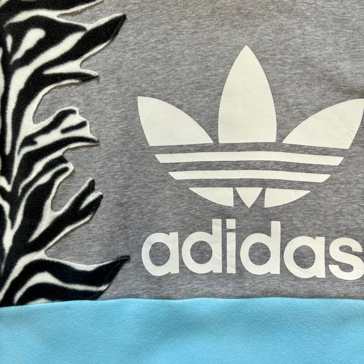Adidas zebra stripe fleece sweatshirt.