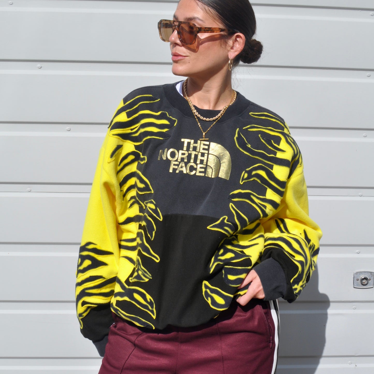 North face yellow zebra stripe patchwork fleece sweatshirt.