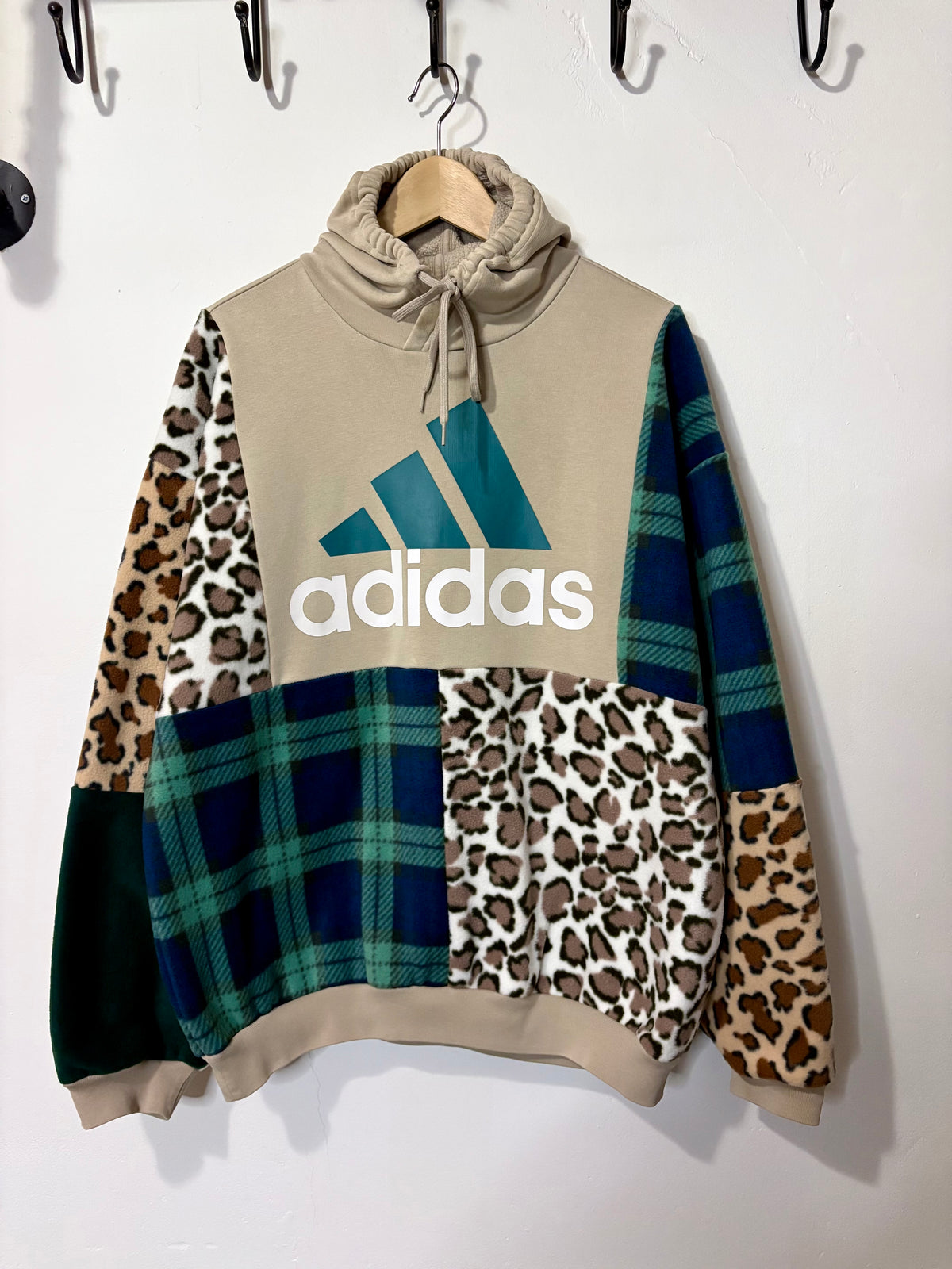 Y2K beige adidas logo clashing checked tartan and leopard print patchwork hoodie sweatshirt.