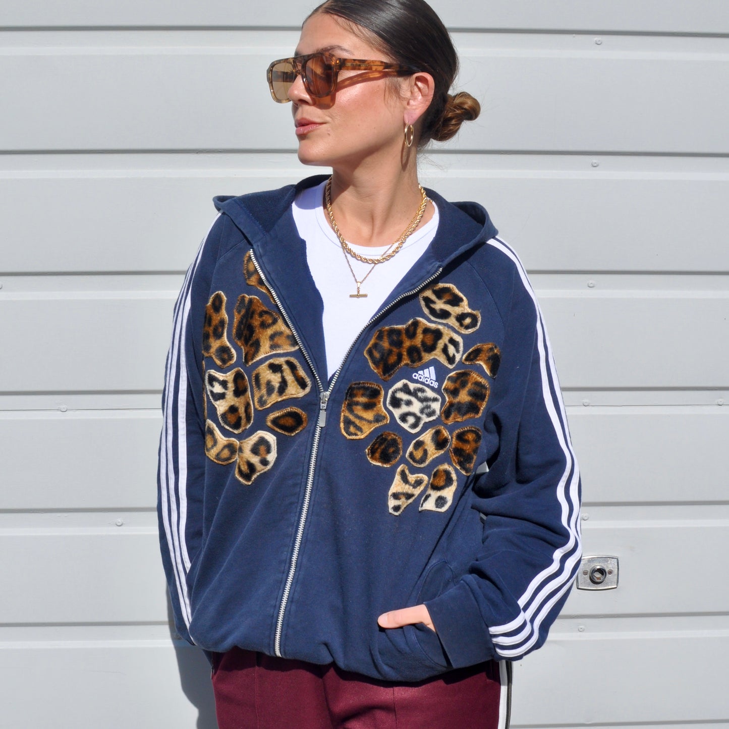 Navy blue adidas leopard patch hoodie sweatshirt.