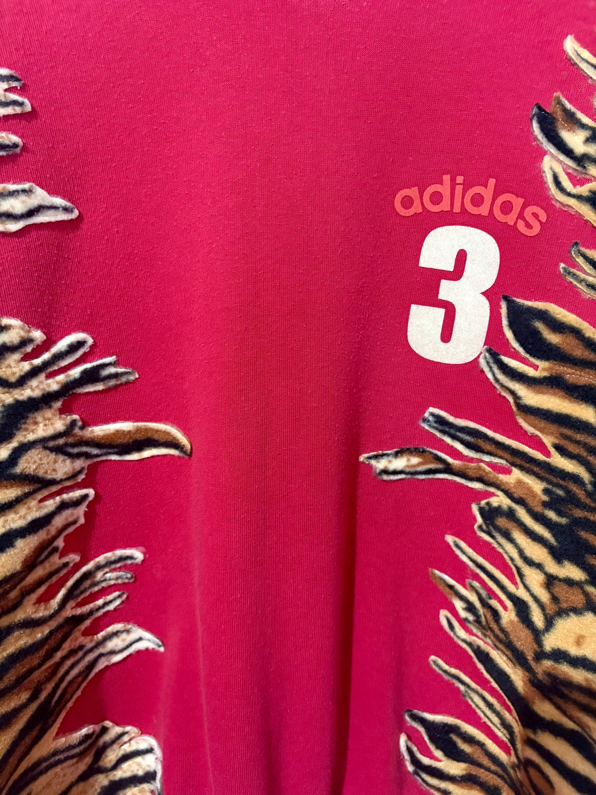 Y2K red adidas tiger print and pink fleece patchwork sweatshirt.