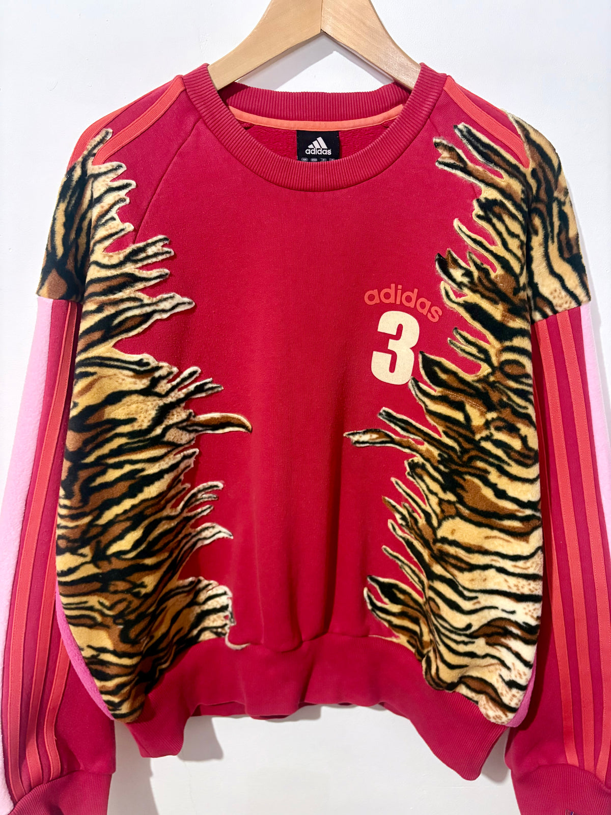 Y2K red adidas tiger print and pink fleece patchwork sweatshirt.