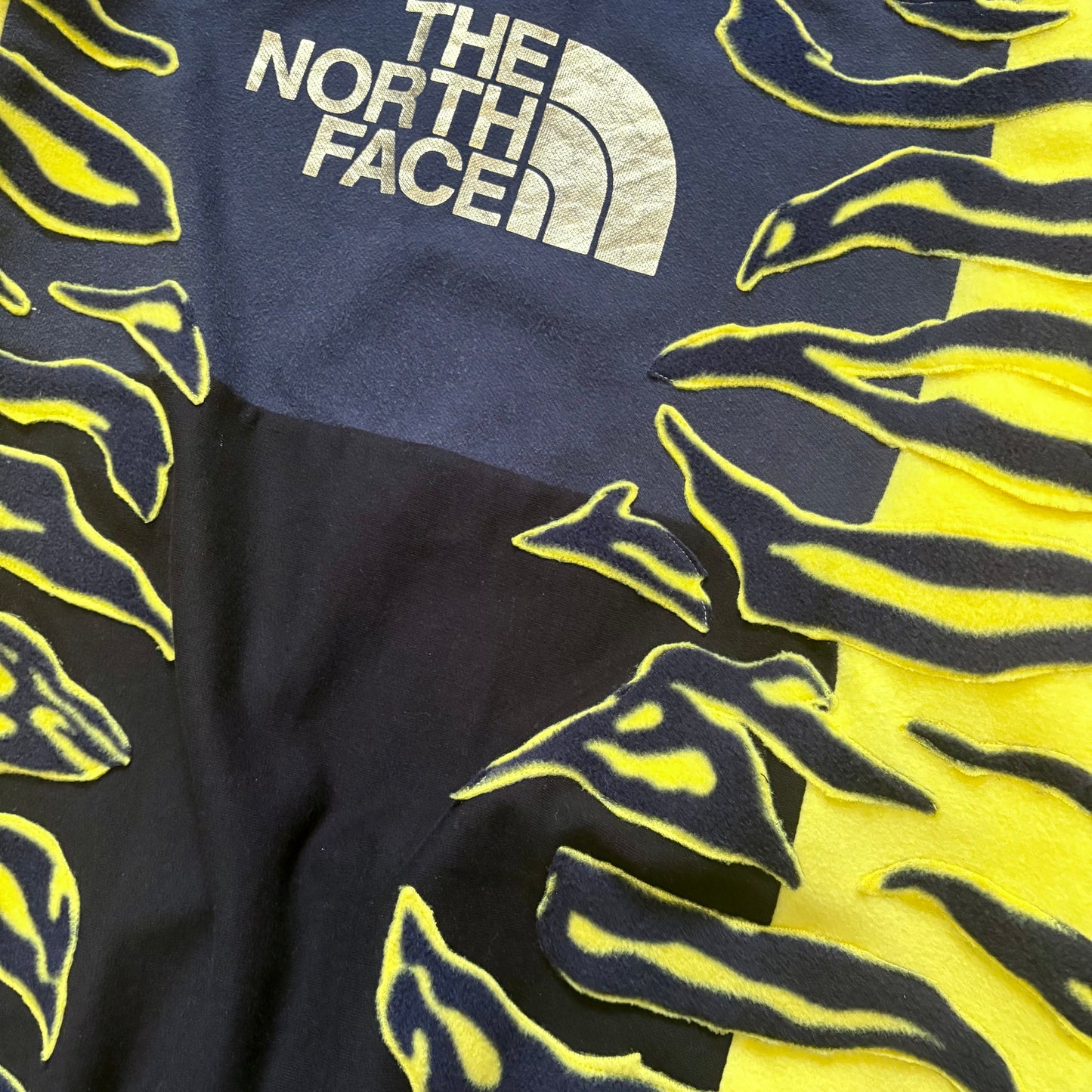 North face yellow zebra stripe patchwork fleece sweatshirt.