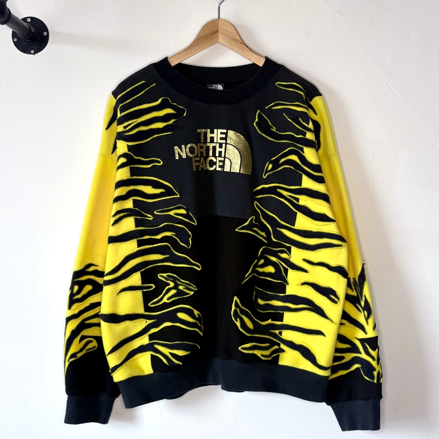 North face yellow zebra stripe patchwork fleece sweatshirt.