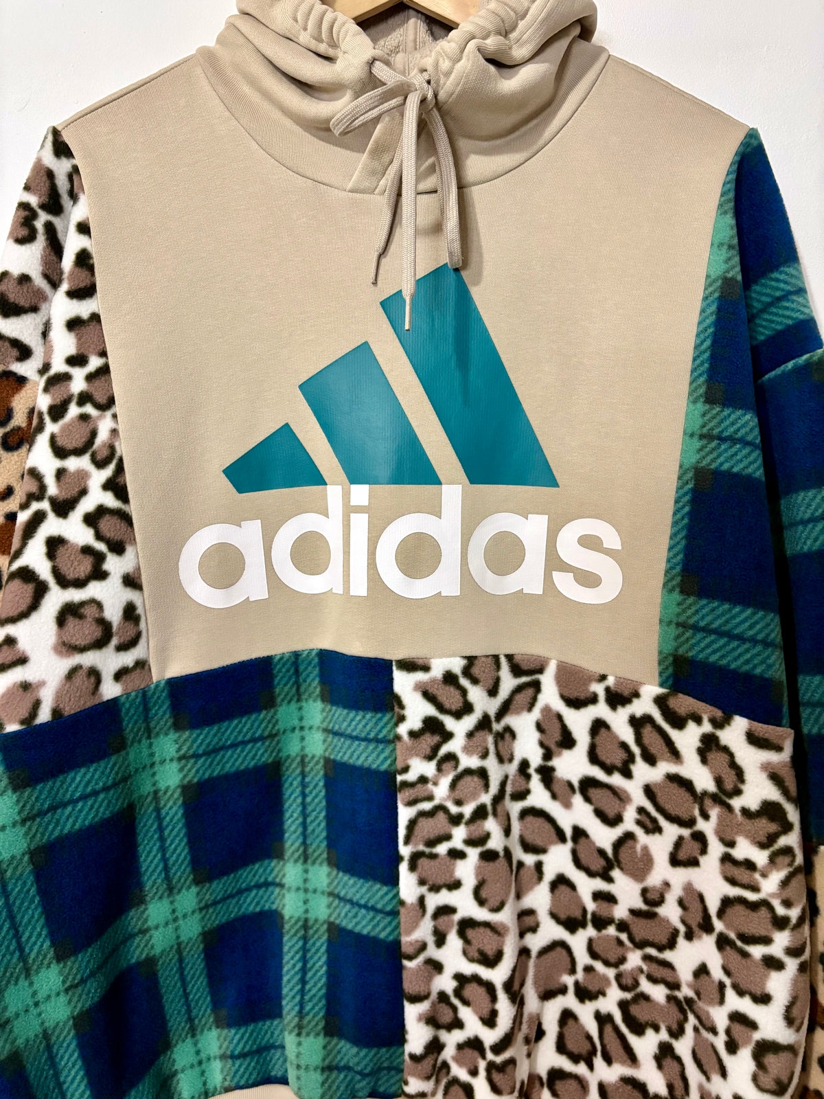 Y2K beige adidas logo clashing checked tartan and leopard print patchwork hoodie sweatshirt.