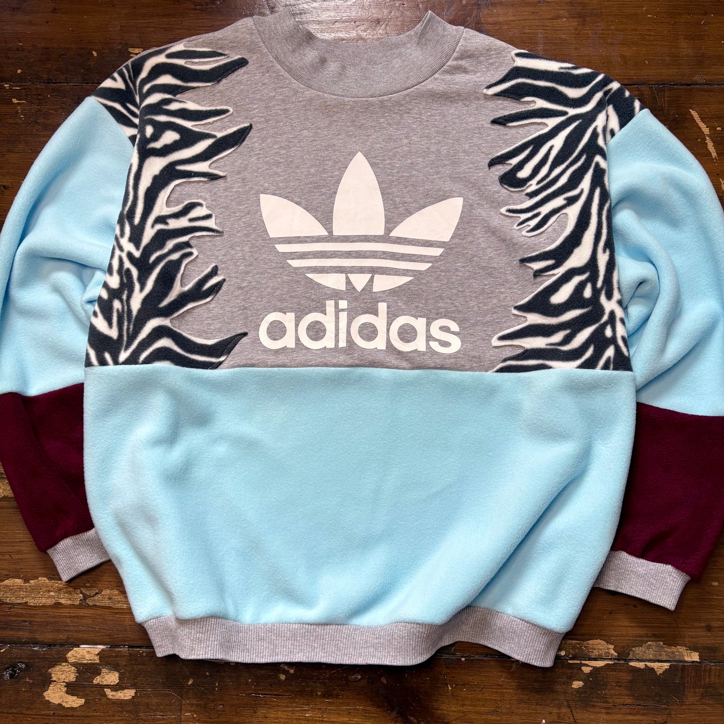 Adidas zebra stripe fleece sweatshirt.