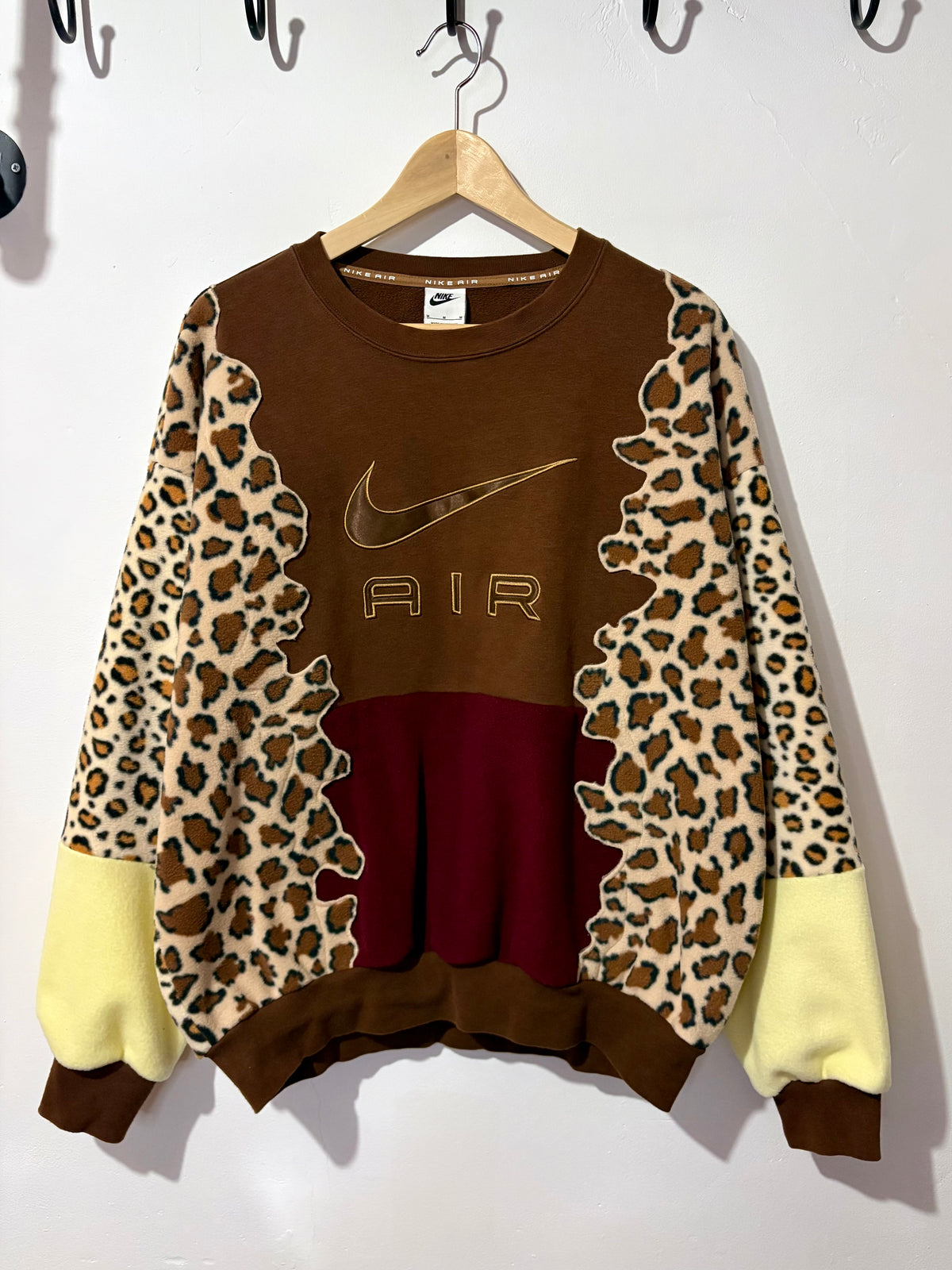 Y2K brown Nike air leopard print, burgundy and butter yellow fleece patchwork sweatshirt.