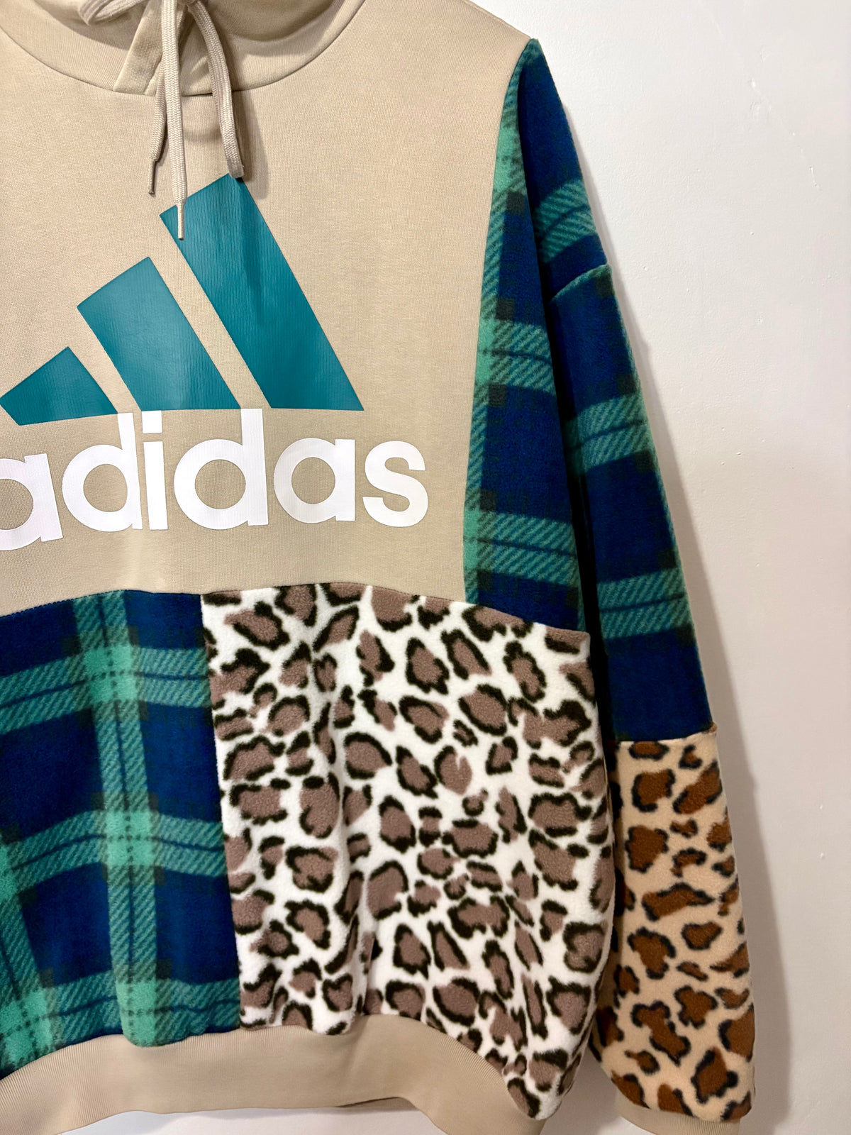 Y2K beige adidas logo clashing checked tartan and leopard print patchwork hoodie sweatshirt.