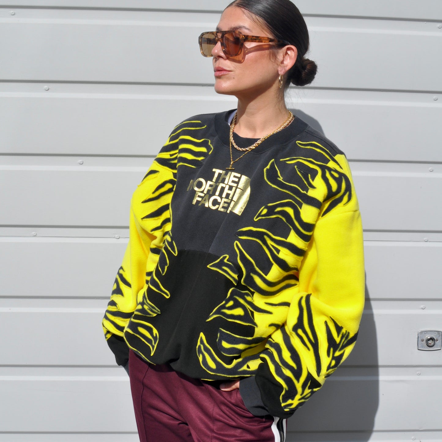 North face yellow zebra stripe patchwork fleece sweatshirt.