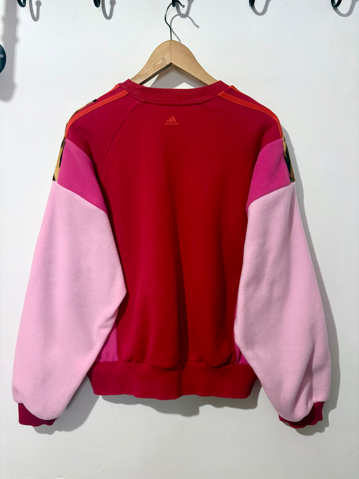 Y2K red adidas tiger print and pink fleece patchwork sweatshirt.