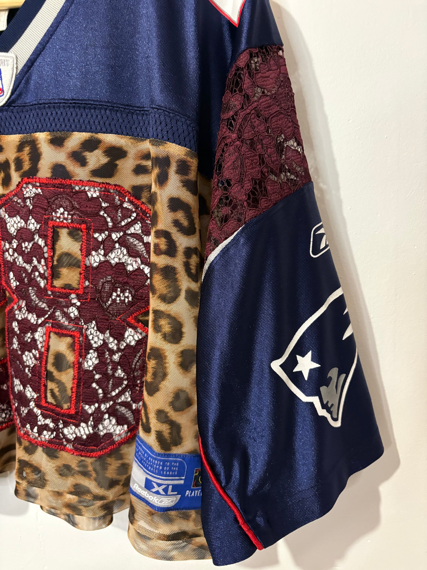 Vintage Y2K Reebok NFL New England Patriots leopard mesh, burgundy lace patchwork cropped jersey tshirt.