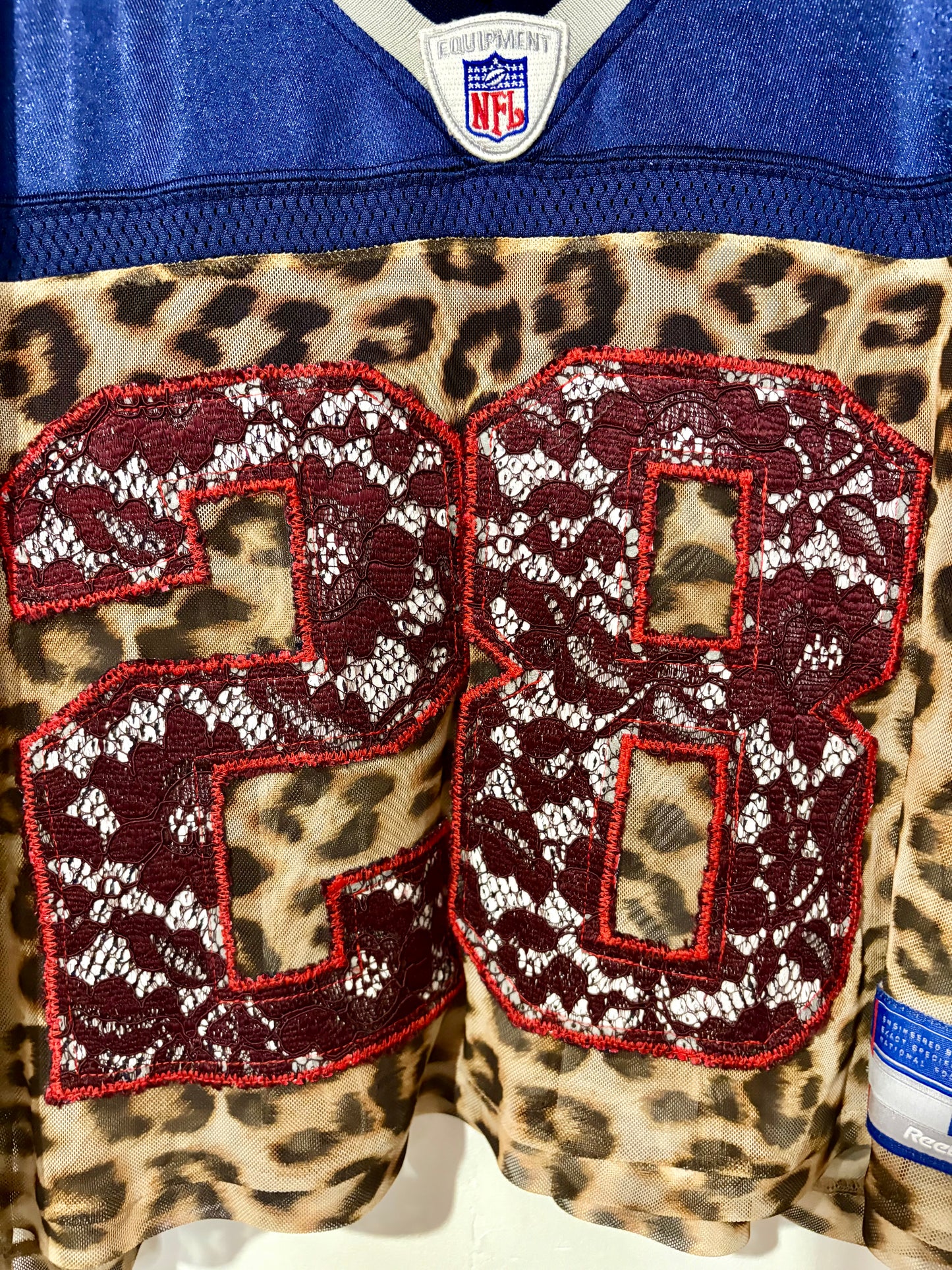 Vintage Y2K Reebok NFL New England Patriots leopard mesh, burgundy lace patchwork cropped jersey tshirt.