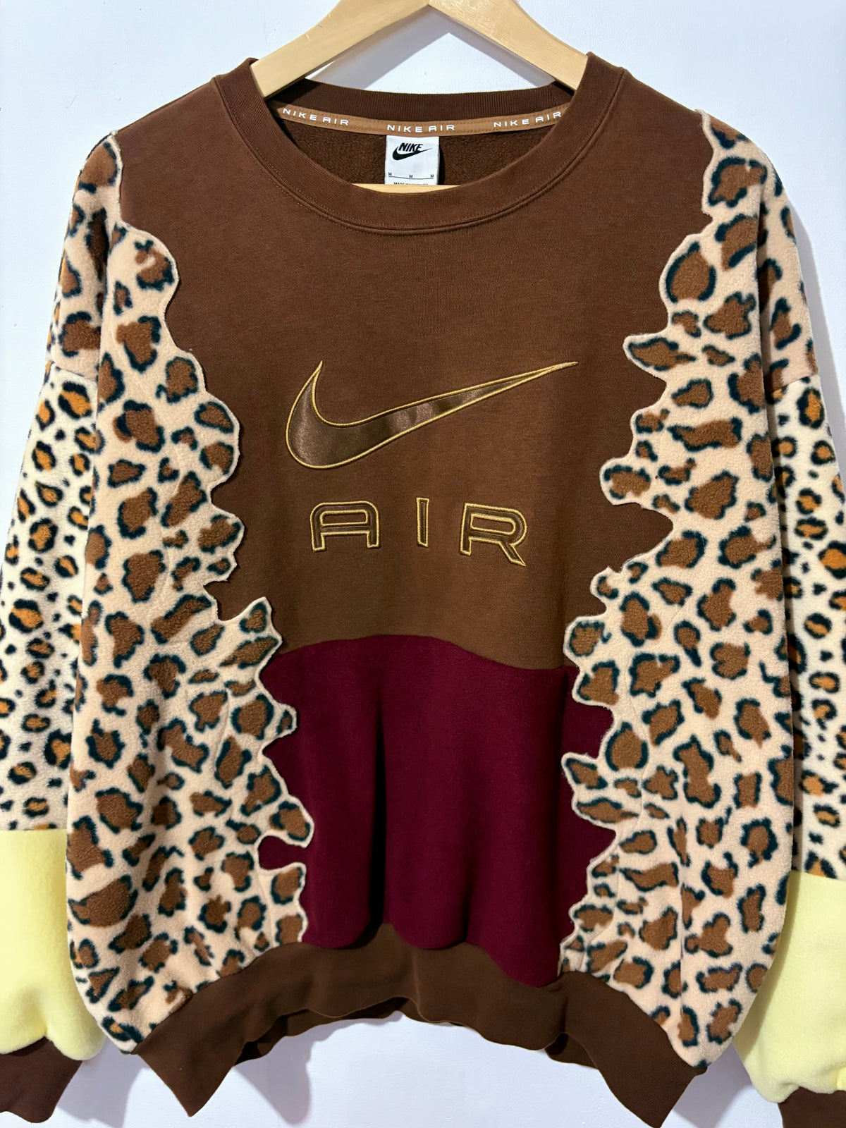 Y2K brown Nike air leopard print, burgundy and butter yellow fleece patchwork sweatshirt.