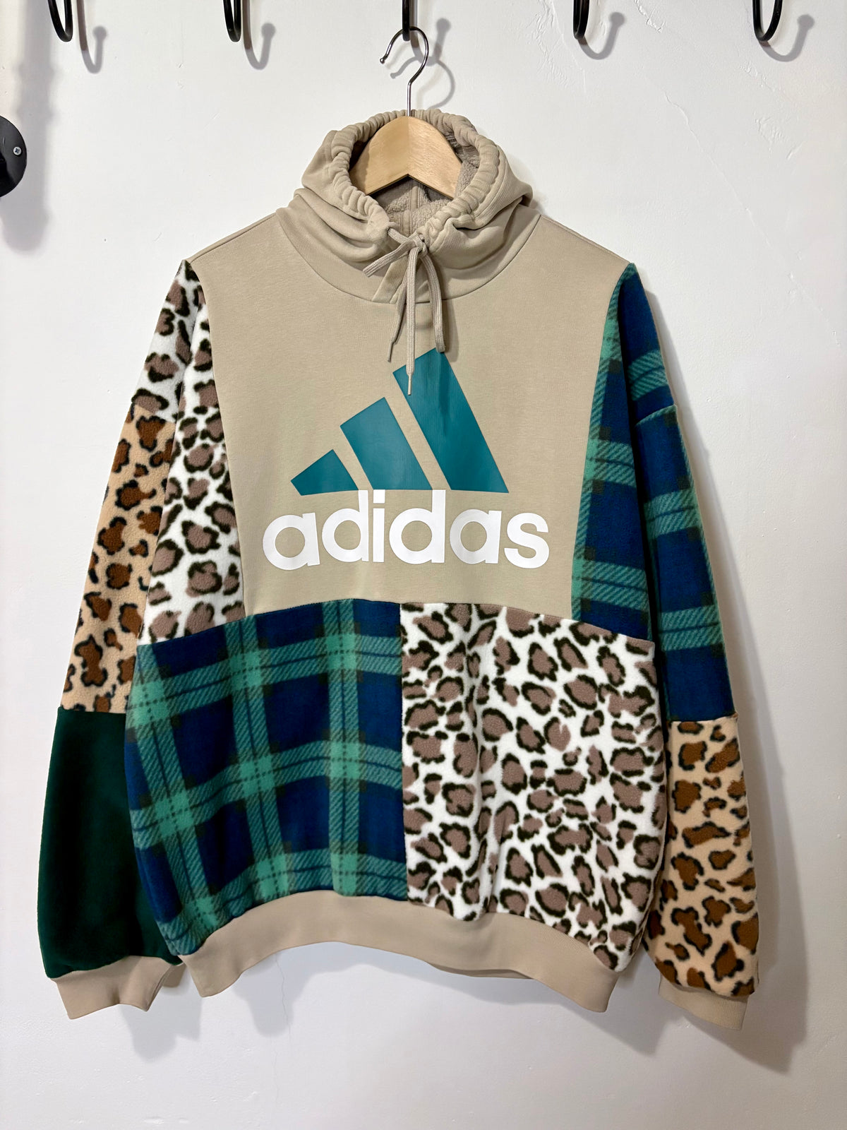 Y2K beige adidas logo clashing checked tartan and leopard print patchwork hoodie sweatshirt.